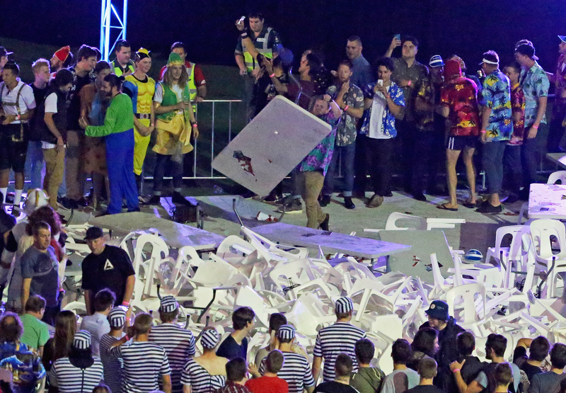 Illustration for article titled Rioting Costumed Fans Halt Australian Darts Competition